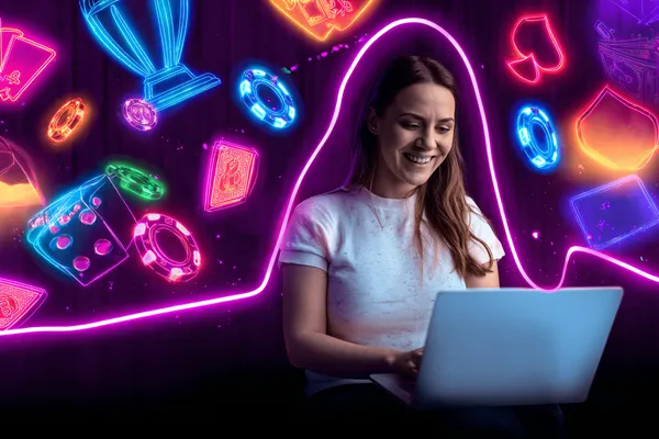 একটি উৎসবমুখর অনুষ্ঠানে স্মার্টফোন ব্যবহার করছেন একজন খেলোয়াড়—যা 777BED–এর সম্পূর্ণ মোবাইল-ফ্রেন্ডলি অভিজ্ঞতাকে তুলে ধরে।