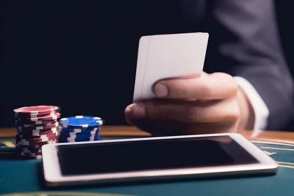 A confident dealer surrounded by casino chips inviting players to access their 777BED account, reflecting quick and easy login options.