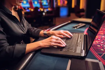 A laptop glowing with a bright login prompt in a minimalistic setup, symbolizing the protected access system at 777BED.